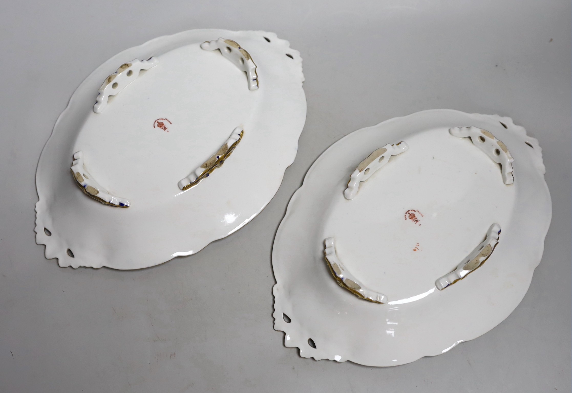 A pair of Royal Crown Derby Imari footed oval dishes, 29cms wide